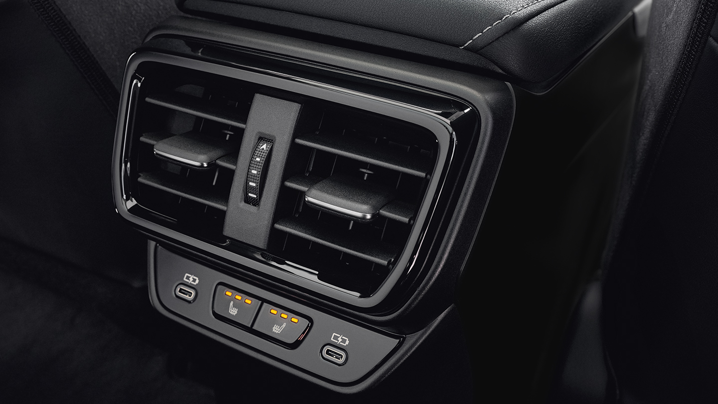 Detail of rear console showing USB port and rear-seat ventilation control.
